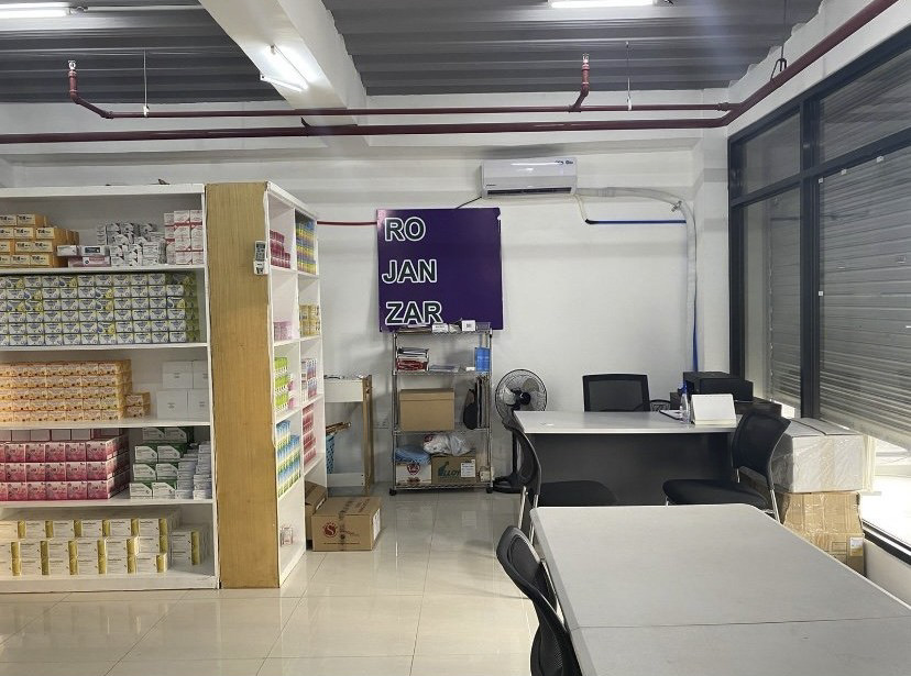 Rojanzar Pharmacy stock room with shelved inventory