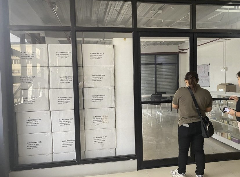 Warehouse receiving area with stacked stock from XL Laboratories